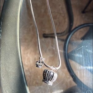 18 inch pandora necklace with two charms . Bug crown and small crown charms